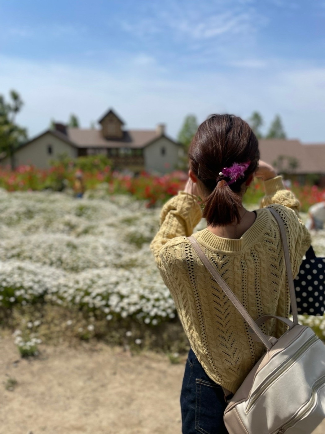 Kohaku enjoying a quiet moment in a flower garden